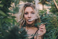 Woman-Smoking-in-Cannabis-Bushes